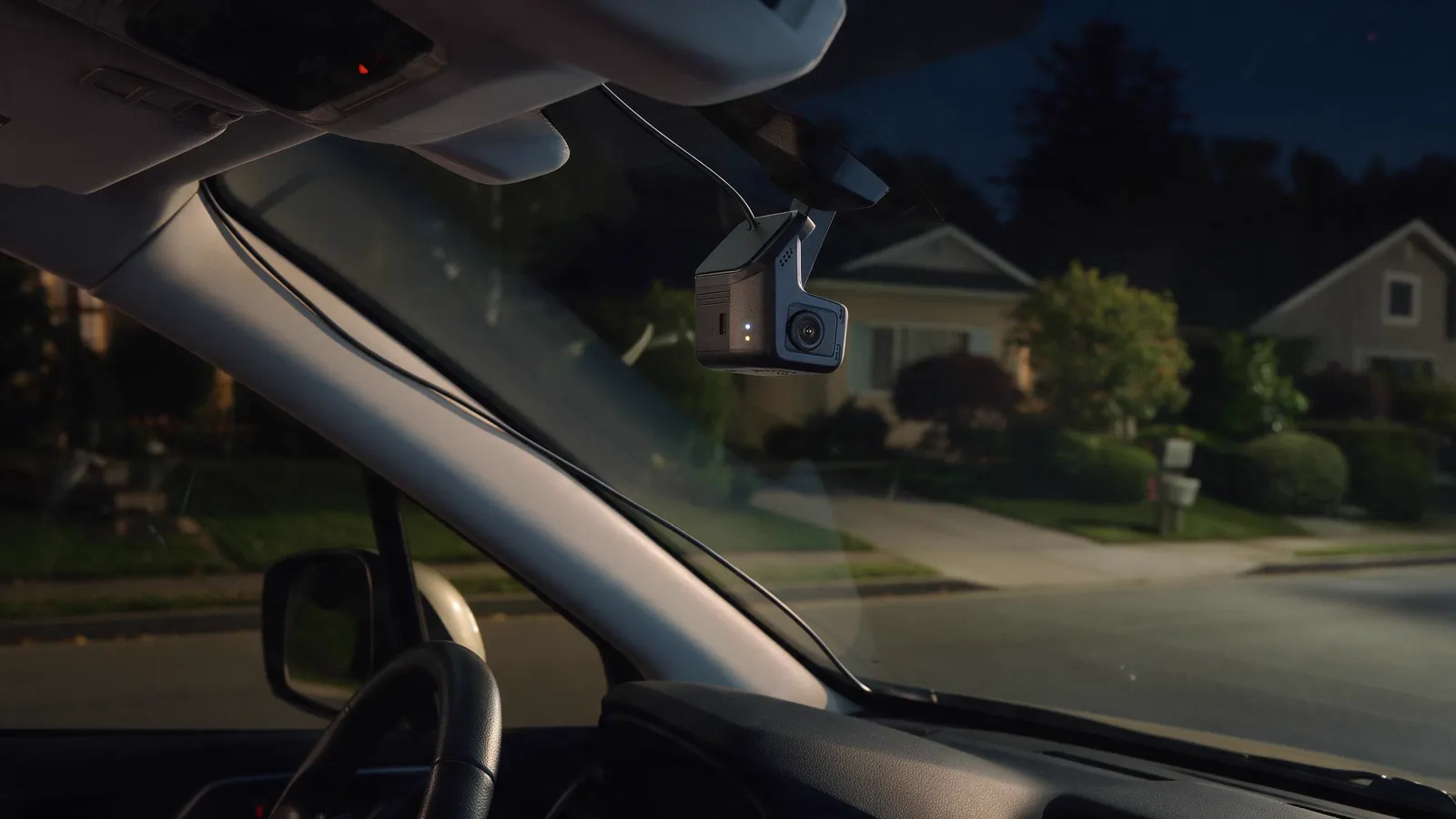 Hardwired dashcam in a car parked at night